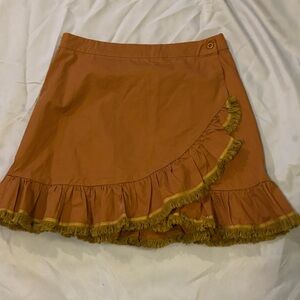 Listicle Wrap Skirt in Tan and light Green Fringe.